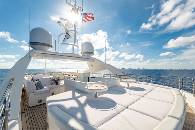 About Time Yacht Photos Pics Luxurious Sunseeker 40 Metre Yacht 2010 on open sea with city skyline.