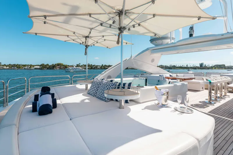 About Time Yacht Photos Pics Luxurious Sunseeker 40 Metre Yacht 2010 with elegant deck, sun loungers, and ocean view.