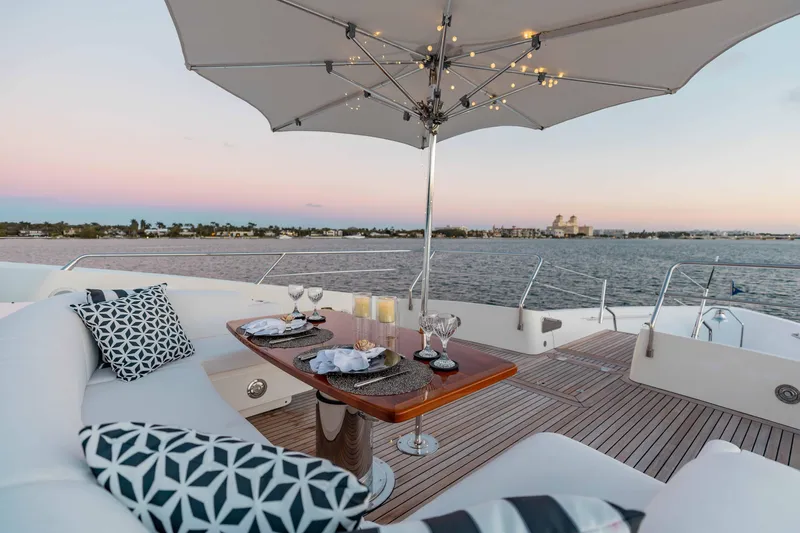 About Time Yacht Photos Pics Luxurious Sunseeker 40 Metre Yacht deck with elegant dining setup, 2010 model.