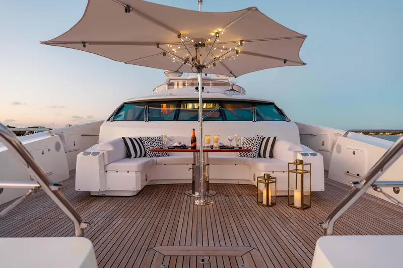 About Time Yacht Photos Pics Luxurious Sunseeker 40 Metre Yacht deck with elegant seating, umbrella, and ambient lighting, 2010 model.