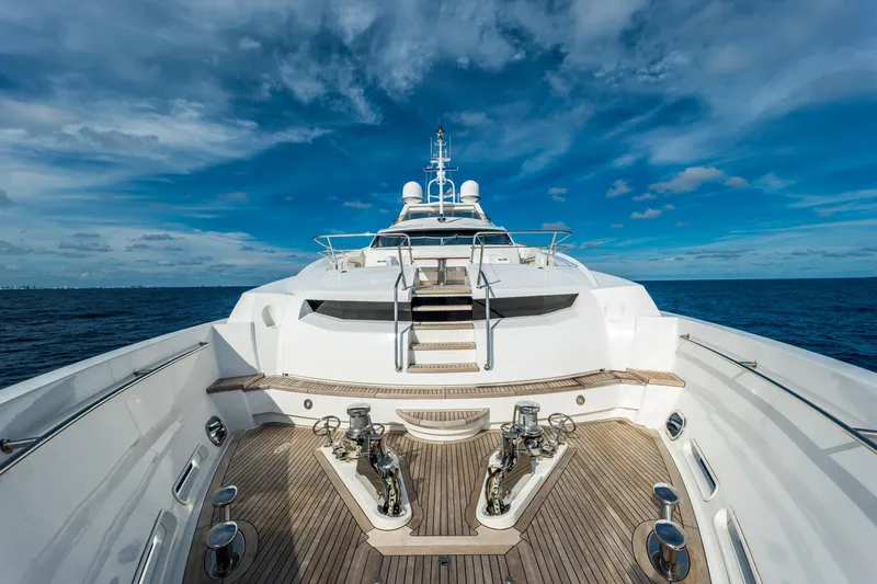 About Time Yacht Photos Pics Luxurious 2010 Sunseeker 40 Metre Yacht on open sea under blue sky.
