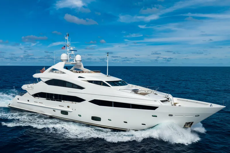 About Time Yacht Photos Pics Luxurious 2010 Sunseeker 40 Metre Yacht cruising on open sea under blue sky.