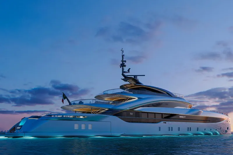  Yacht Photos Pics Luxurious 2027 ISA Gran Turismo 66 yacht at sunset, featuring sleek design and ambient lighting.