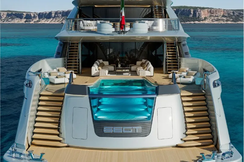  Yacht Photos Pics Luxurious 2027 ISA Gran Turismo 66 yacht with pool, docked in turquoise waters.