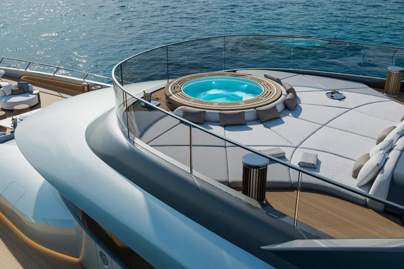  Yacht Photos Pics Luxurious ISA Gran Turismo 66 yacht deck with jacuzzi, 2027 model, overlooking serene ocean waters.