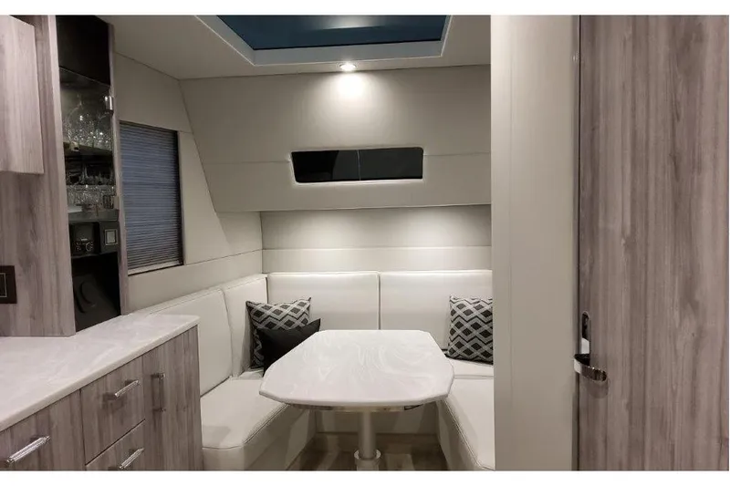  Yacht Photos Pics Interior of 2023 Formula 500 Super Sport Crossover with modern seating and table.