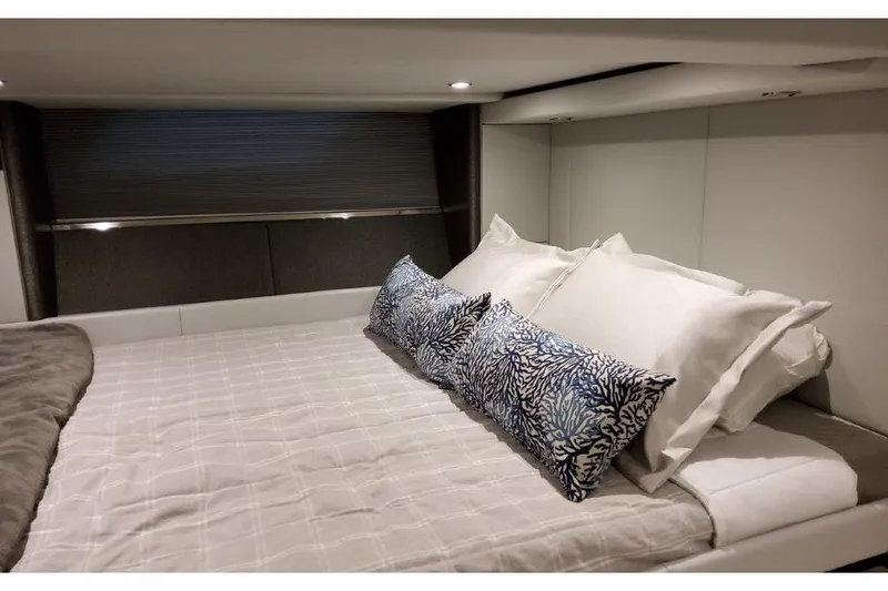  Yacht Photos Pics Luxurious cabin interior of 2023 Formula 500 Super Sport Crossover with plush bedding.