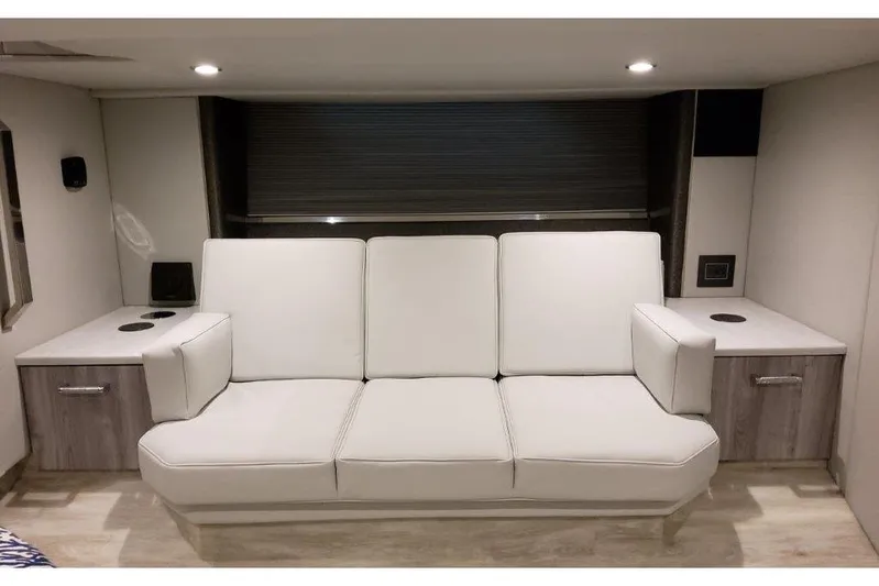  Yacht Photos Pics Luxurious interior of 2023 Formula 500 Super Sport Crossover with modern white sofa and cabinetry.