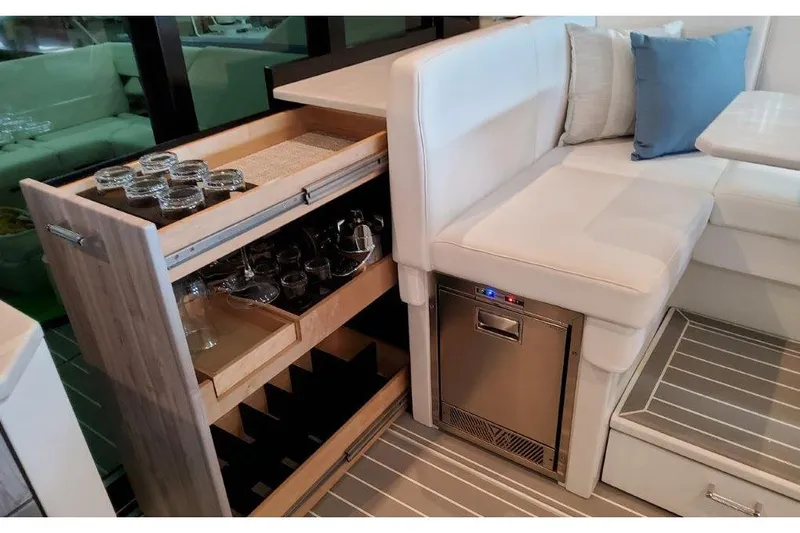  Yacht Photos Pics Luxurious interior of 2023 Formula 500 Super Sport Crossover with elegant seating and storage.