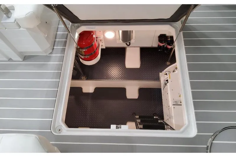  Yacht Photos Pics 2023 Formula 500 Super Sport Crossover engine compartment with fire extinguisher and equipment.