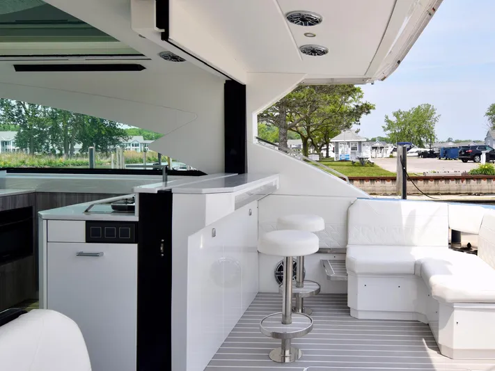  Yacht Photos Pics Luxurious interior of 2023 Formula 500 Super Sport Crossover yacht with modern seating and kitchenette.