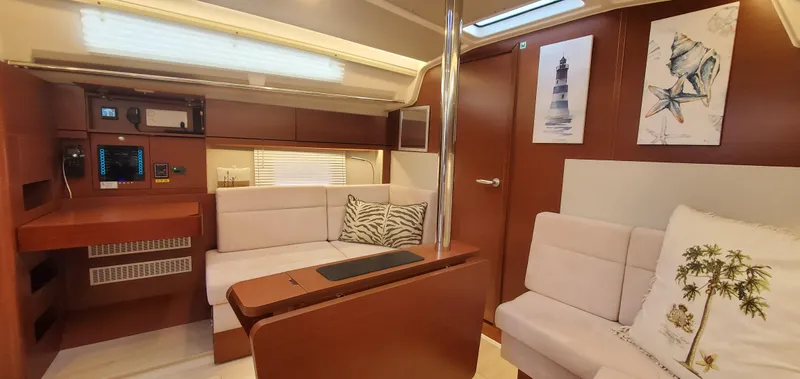 Hanse 388 #396 Yacht Photos Pics Luxurious interior of 2024 Hanse 388 yacht with modern seating and decor.