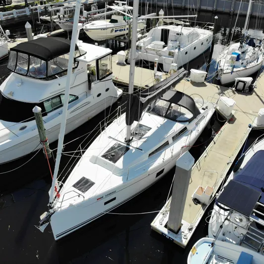 Hanse 388 #396 Yacht Photos Pics 2024 Hanse 388 sailboat docked at marina, aerial view.