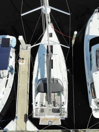 Hanse 388 #396 Yacht Photos Pics Aerial view of a 2024 Hanse 388 sailboat docked at a marina.