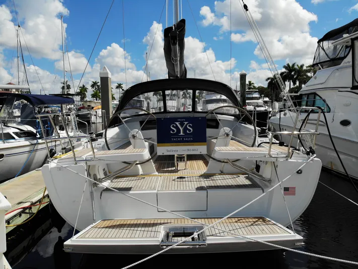 Hanse 388 #396 Yacht Photos Pics 2024 Hanse 388 yacht docked at marina under blue sky.