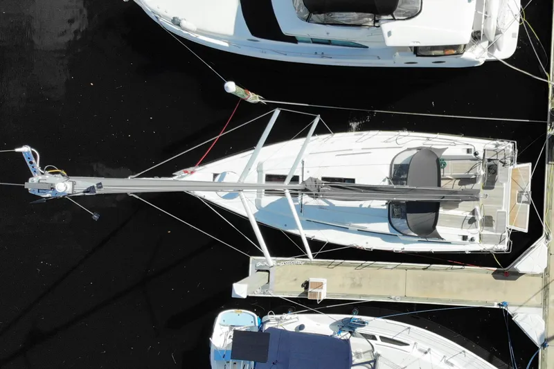 Hanse 388 #396 Yacht Photos Pics Aerial view of 2024 Hanse 388 sailboat docked among other boats.