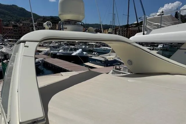  Yacht Photos Pics Luxurious 2002 Riva 59 Mercurius yacht docked in a scenic marina.
