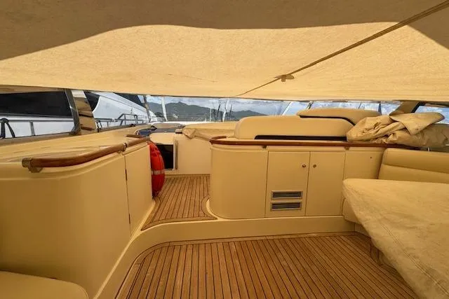  Yacht Photos Pics Luxurious 2002 Riva 59 Mercurius yacht interior with elegant wood flooring and seating.