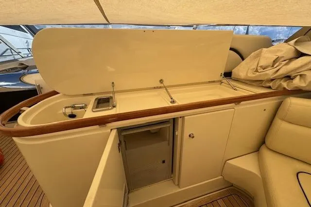  Yacht Photos Pics Interior view of a 2002 Riva 59 Mercurius yacht, featuring a sleek kitchenette area.