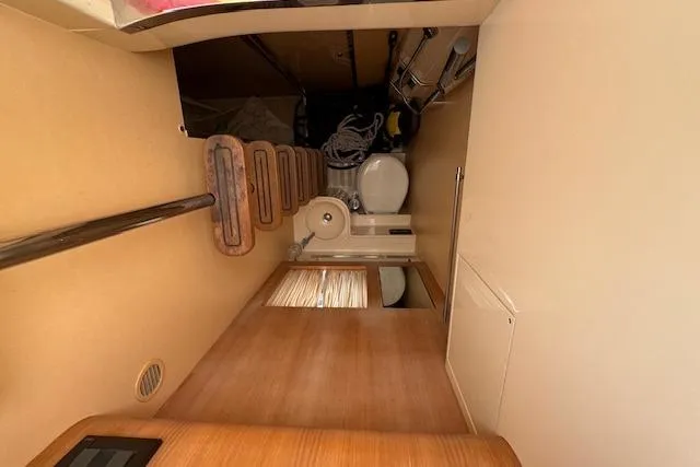  Yacht Photos Pics Interior of 2002 Riva 59 Mercurius yacht showing compact bathroom and storage area.