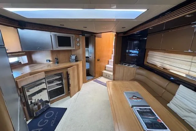  Yacht Photos Pics Luxurious interior of a 2002 Riva 59 Mercurius yacht with modern amenities.