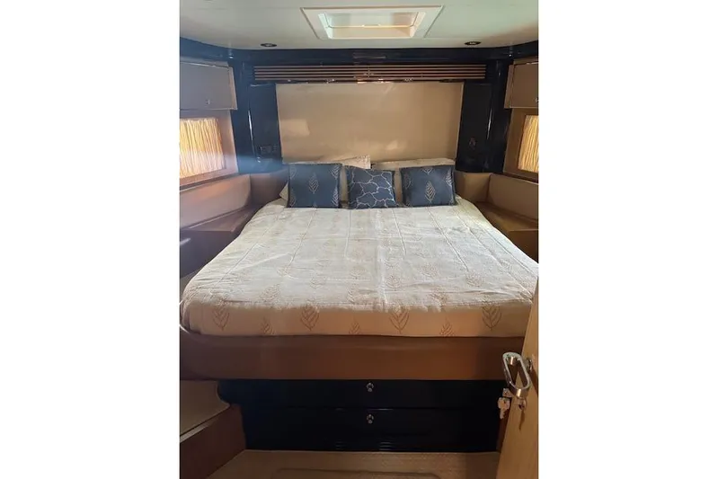  Yacht Photos Pics Luxurious bedroom interior of 2002 Riva 59 Mercurius yacht with elegant bedding.
