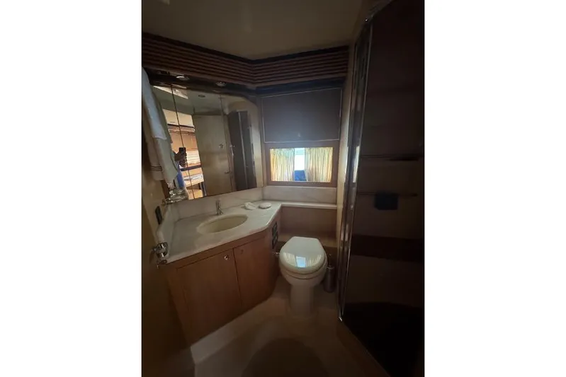 Yacht Photos Pics Luxurious bathroom interior of 2002 Riva 59 Mercurius yacht with modern fixtures.