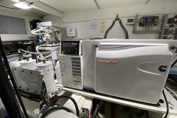 Whole Life Yacht Photos Pics Engine room of 2011 Grand Banks 46 Eastbay SX with Cummins Onan marine generator.