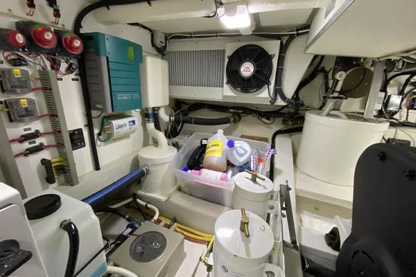 Whole Life Yacht Photos Pics Engine room of 2011 Grand Banks 46 Eastbay SX with equipment and maintenance supplies.