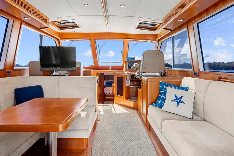 Whole Life Yacht Photos Pics Luxurious interior of 2011 Grand Banks 46 Eastbay SX yacht with plush seating and modern amenities.