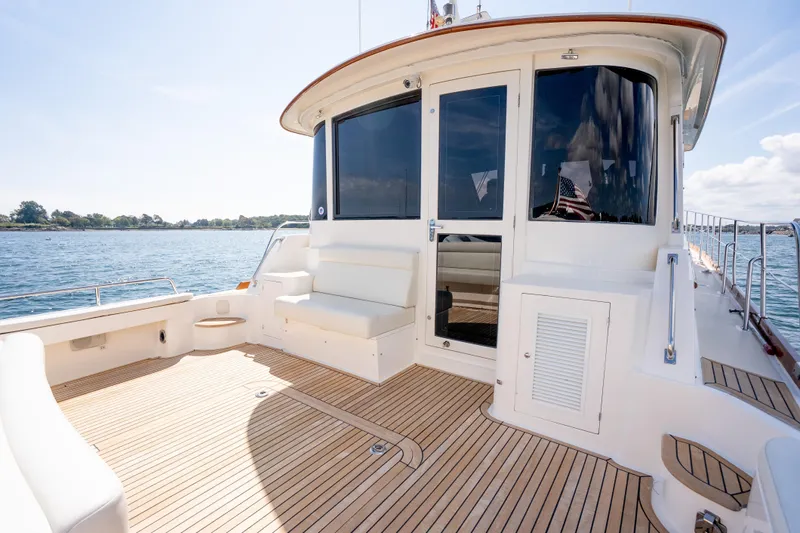 Whole Life Yacht Photos Pics 2011 Grand Banks 46 Eastbay SX yacht with spacious deck and elegant seating.