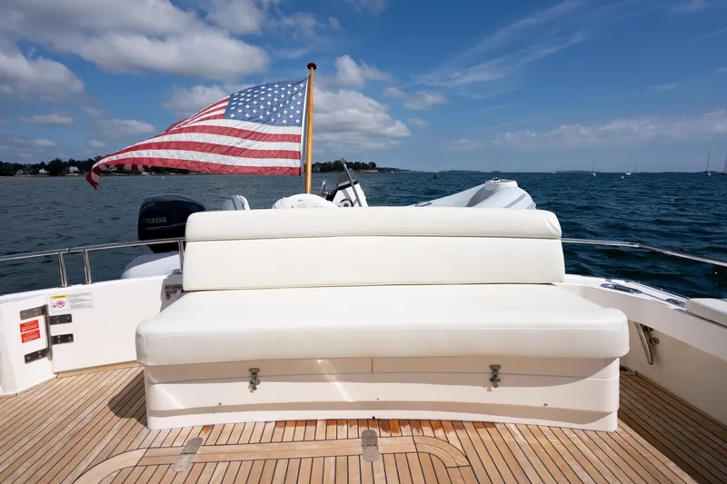Whole Life Yacht Photos Pics Grand Banks 46 Eastbay SX 2011 yacht with American flag, white seating, and ocean view.