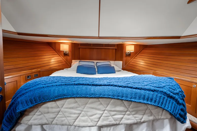 Whole Life Yacht Photos Pics Luxurious cabin interior of 2011 Grand Banks 46 Eastbay SX with cozy bedding.