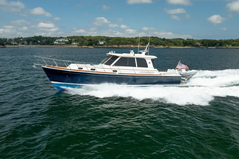 Whole Life Yacht Photos Pics 2011 Grand Banks 46 Eastbay SX cruising on open water, displaying sleek design and performance.