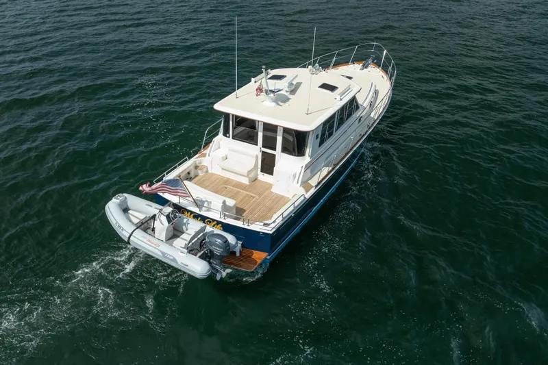 Whole Life Yacht Photos Pics 2011 Grand Banks 46 Eastbay SX yacht cruising on open water.