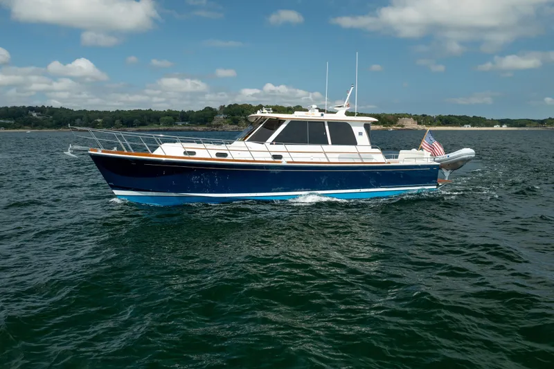 Whole Life Yacht Photos Pics 2011 Grand Banks 46 Eastbay SX yacht cruising on open water under a clear sky.