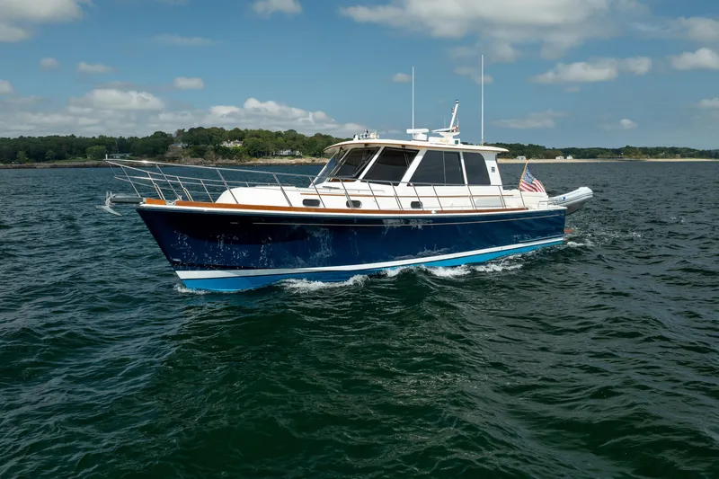 Whole Life Yacht Photos Pics 2011 Grand Banks 46 Eastbay SX yacht cruising on open water under a clear sky.