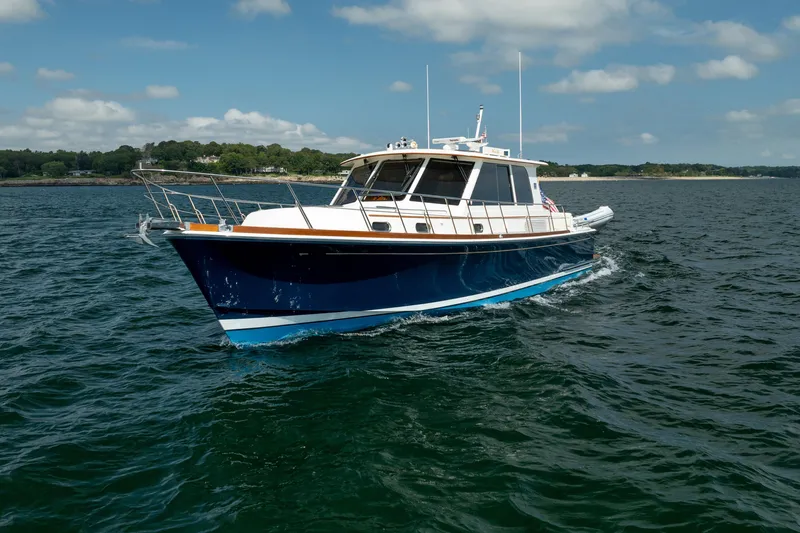 Whole Life Yacht Photos Pics 2011 Grand Banks 46 Eastbay SX yacht cruising on open water under a clear sky.