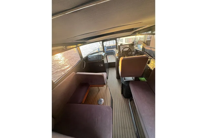  Yacht Photos Pics Interior of 2021 XO EXPLORER 10S boat with seating and steering wheel.