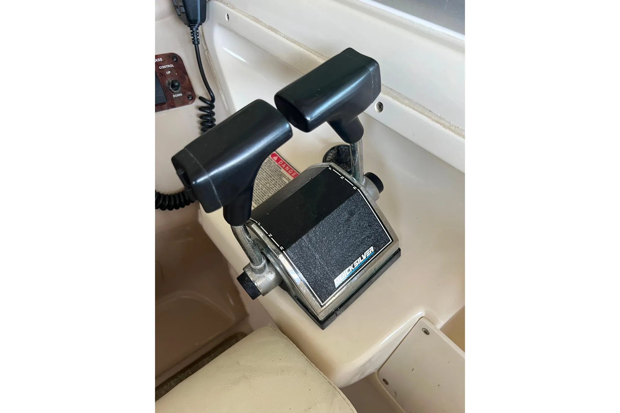 Throttle controls on a 1999 Sea Ray 290 Sundancer boat cockpit.