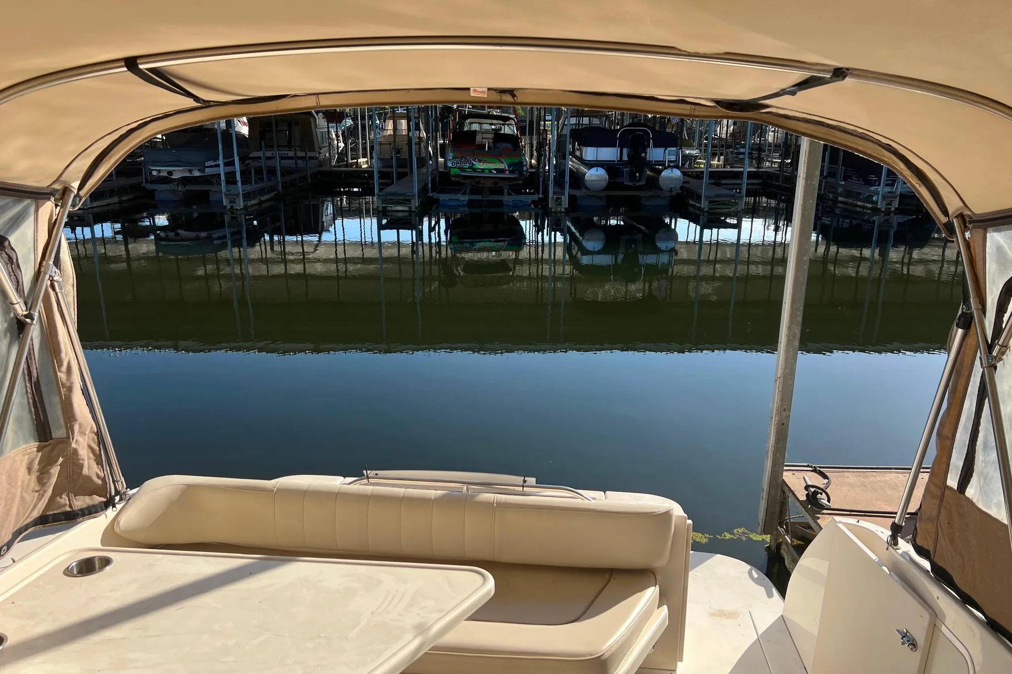 1999 Sea Ray 290 Sundancer interior view with marina backdrop.