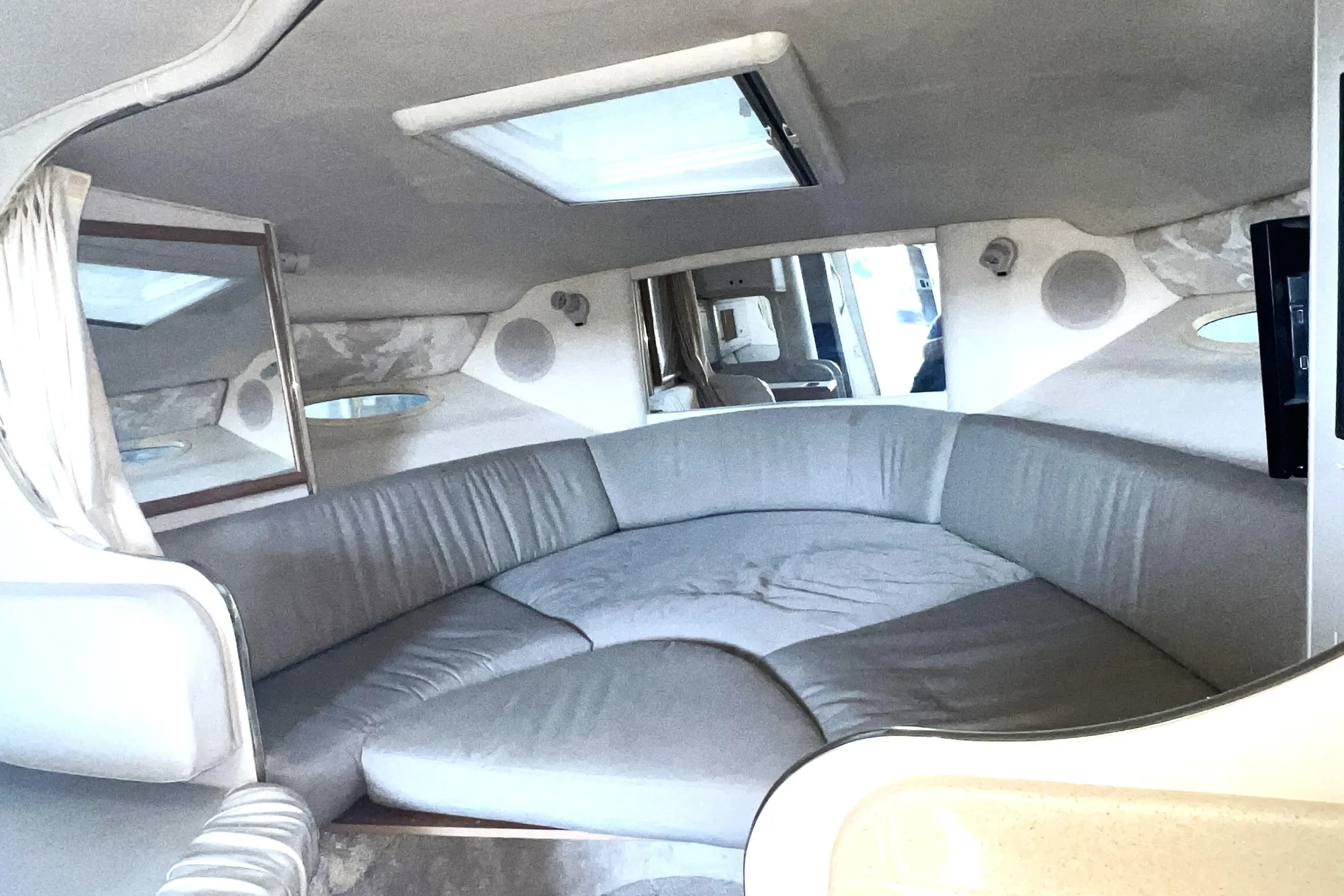 Interior of 1999 Sea Ray 290 Sundancer with spacious seating and modern design.