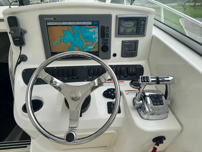  Yacht Photos Pics Control panel of a 2011 Boston Whaler 305 Conquest boat with navigation equipment.