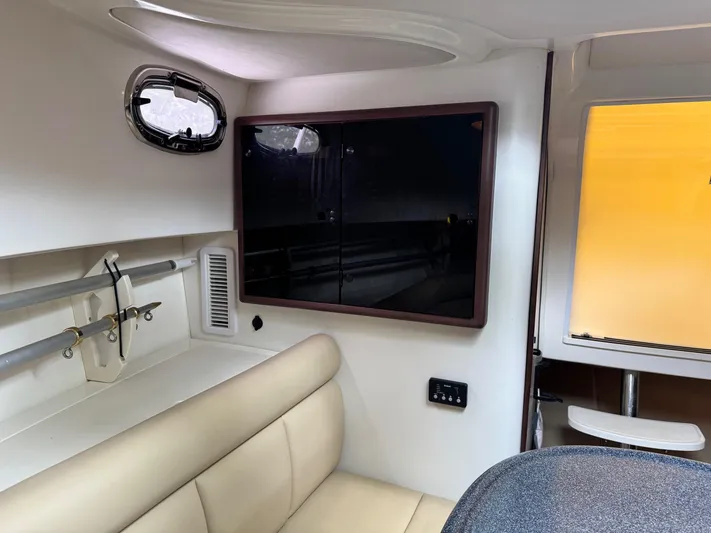  Yacht Photos Pics Interior of a 2011 Boston Whaler 305 Conquest boat, featuring seating and storage.