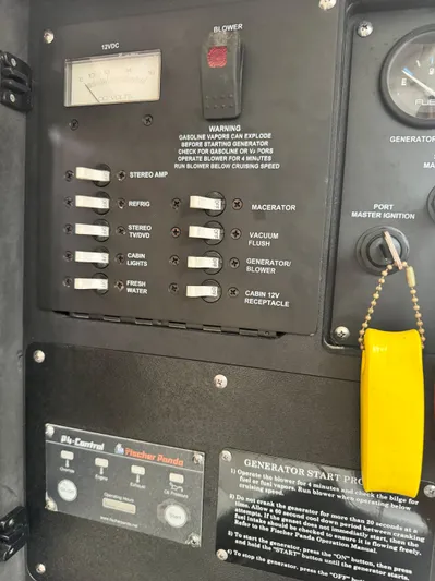  Yacht Photos Pics Control panel of a 2011 Boston Whaler 305 Conquest boat with switches and generator instructions.