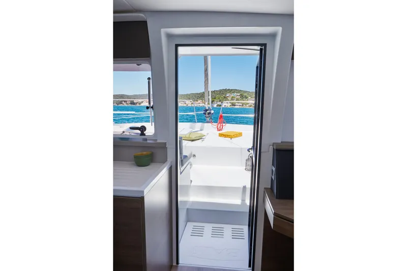 Azure Yacht Photos Pics Interior view of 2025 Bali 4.8 yacht, showcasing doorway to deck with ocean view.