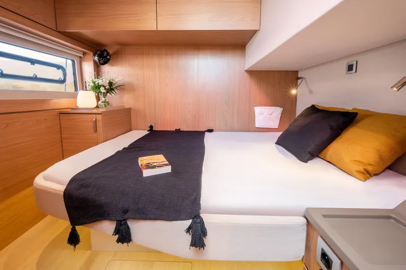 Azure Yacht Photos Pics Luxurious cabin interior of 2025 Bali 4.8 yacht with cozy bed and modern decor.