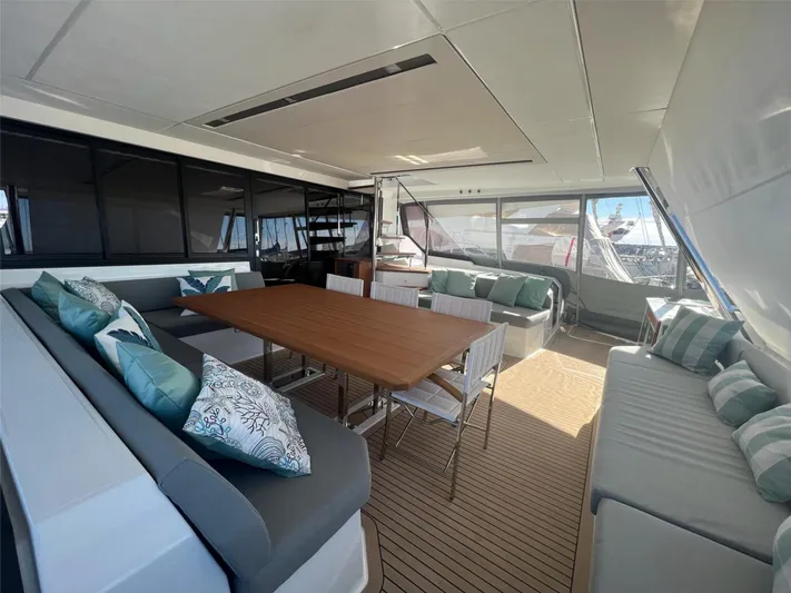 Tbd Yacht Photos Pics Luxurious 2022 Fountaine Pajot Samana 59 yacht interior with elegant seating and dining area.