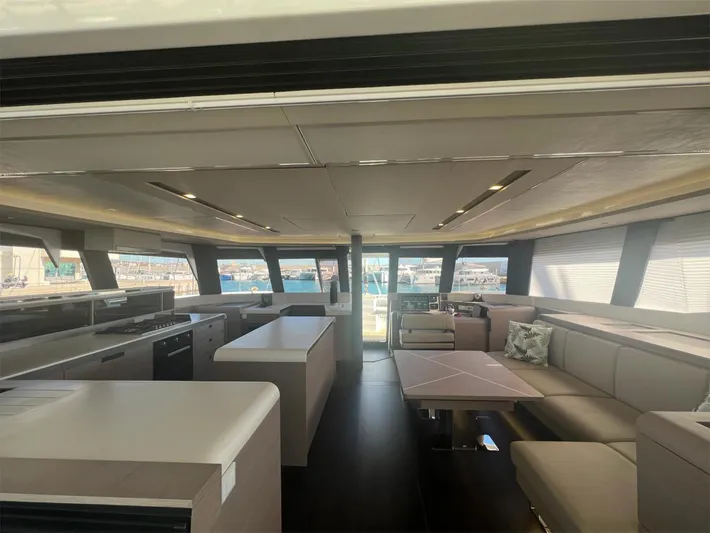Tbd Yacht Photos Pics Luxurious interior of 2022 Fountaine Pajot Samana 59 yacht with modern furnishings.