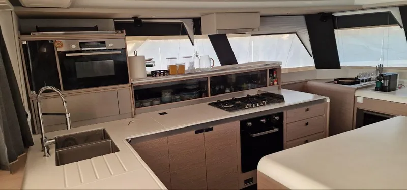 Tbd Yacht Photos Pics Modern kitchen interior of 2022 Fountaine Pajot Samana 59 yacht with sleek design.
